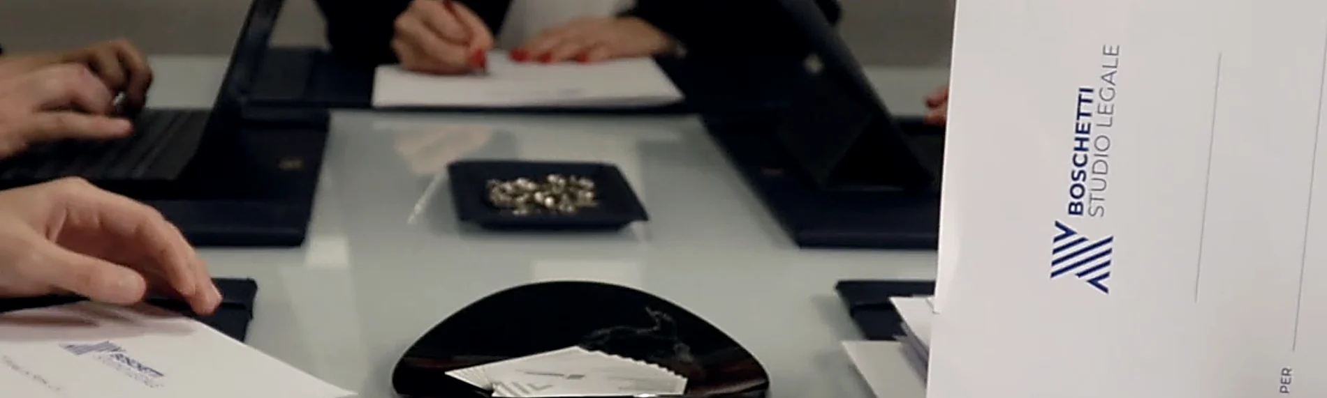 Signing the engagement at the firm in Rome